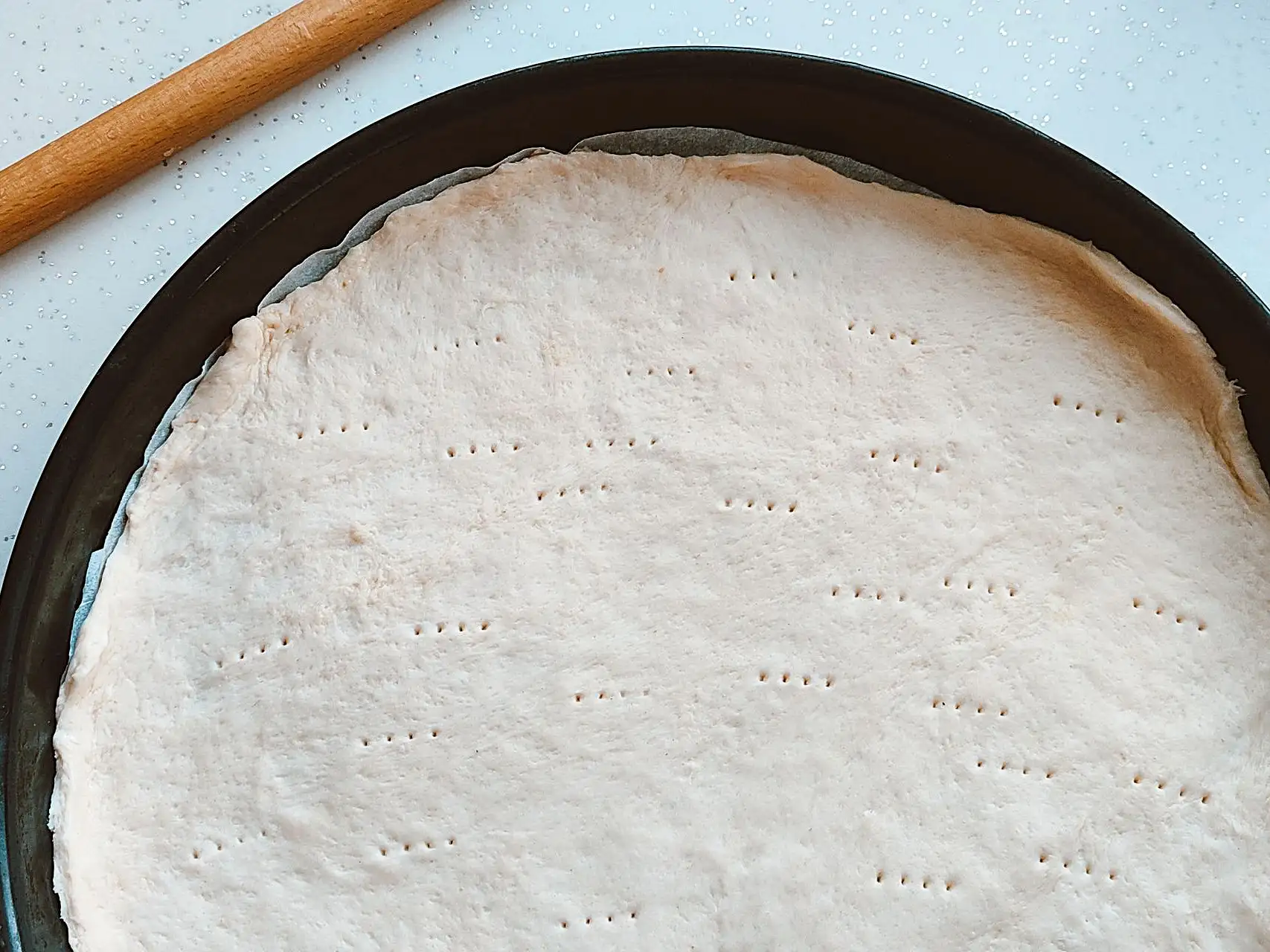 Encapsulated calcium propionate powder and pizza crust samples prepared for a bakery formulation trial